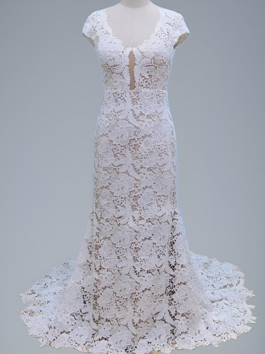 Full-length shot of  lace PARIS wedding dress with short cap sleeves and sweep train on a figurine