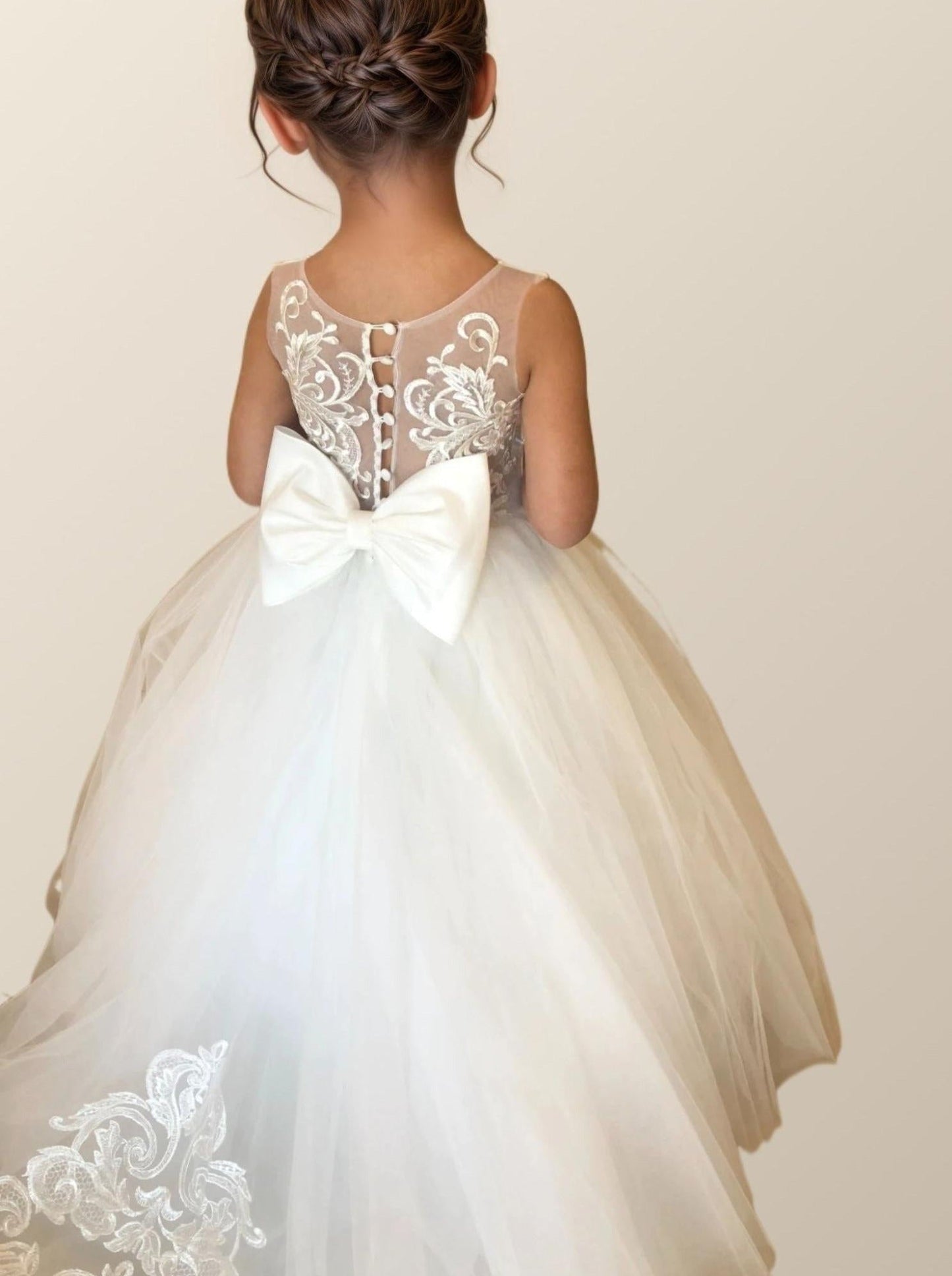 Flower girl in PATRICIA Dress posing with button back design