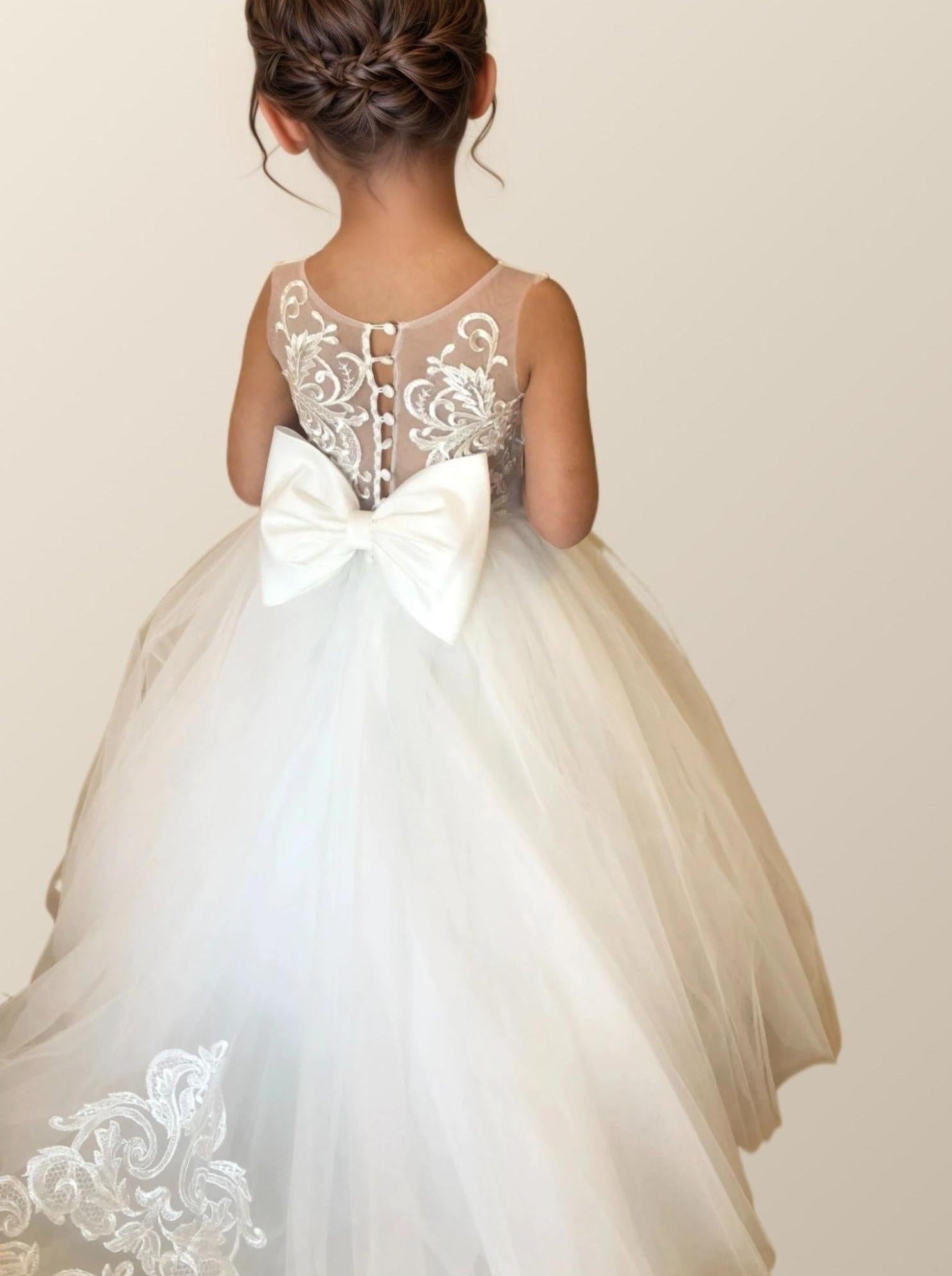 Flower girl in PATRICIA Dress posing with button back design