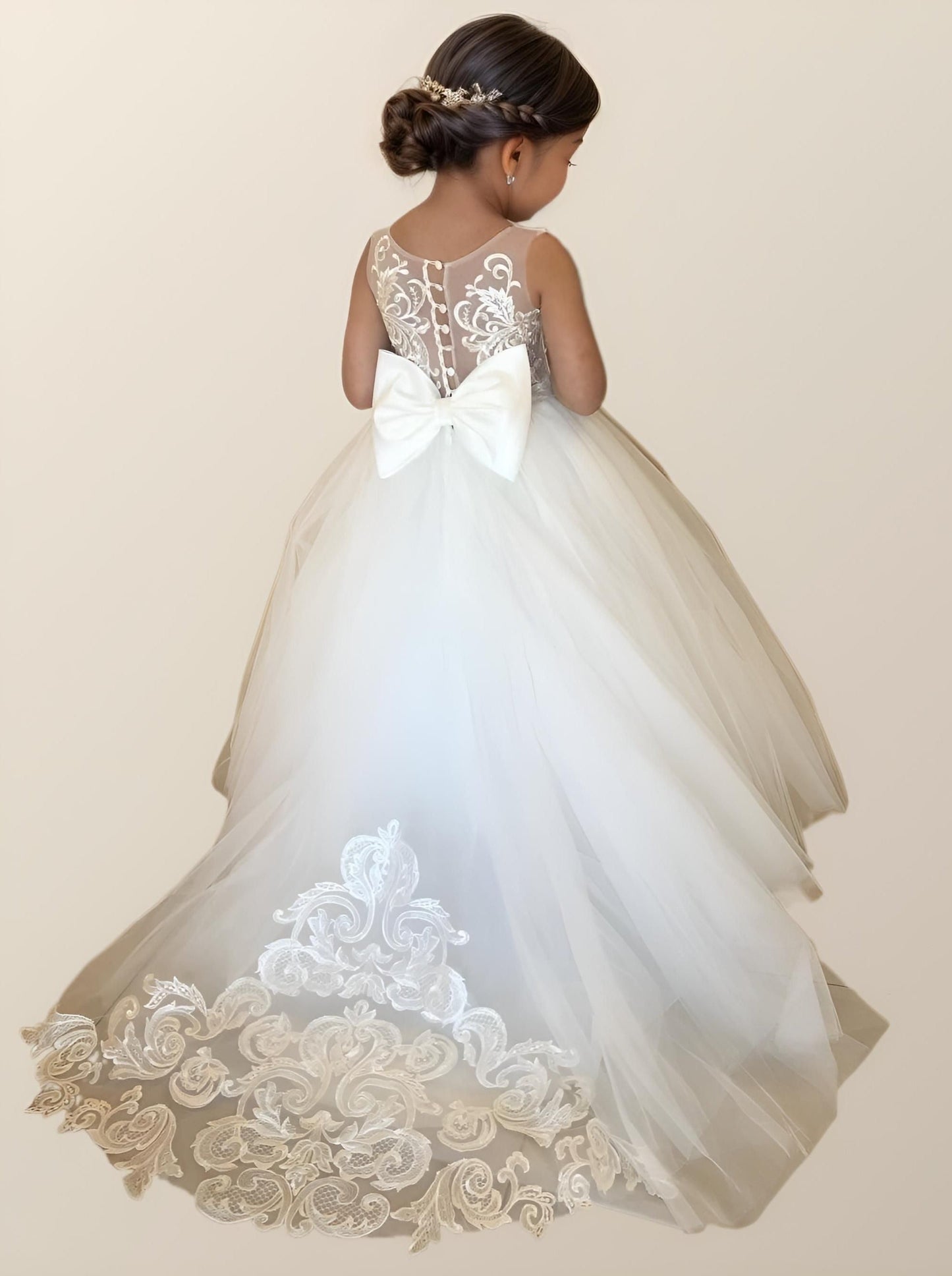 Flower girl wearing PATRICIA Girl Dress with floral appliques and bow