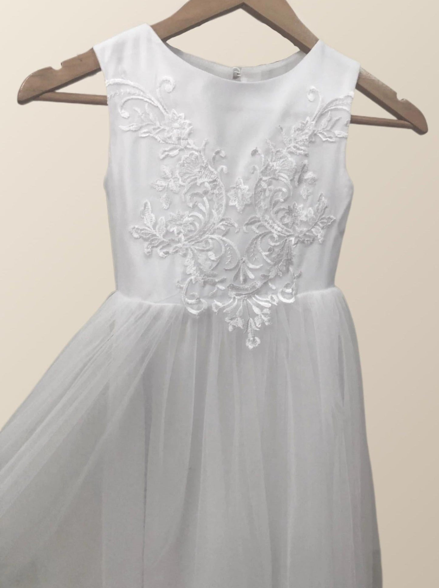 Close-up of PATRICIA Girl Dress showing floral appliques and beading