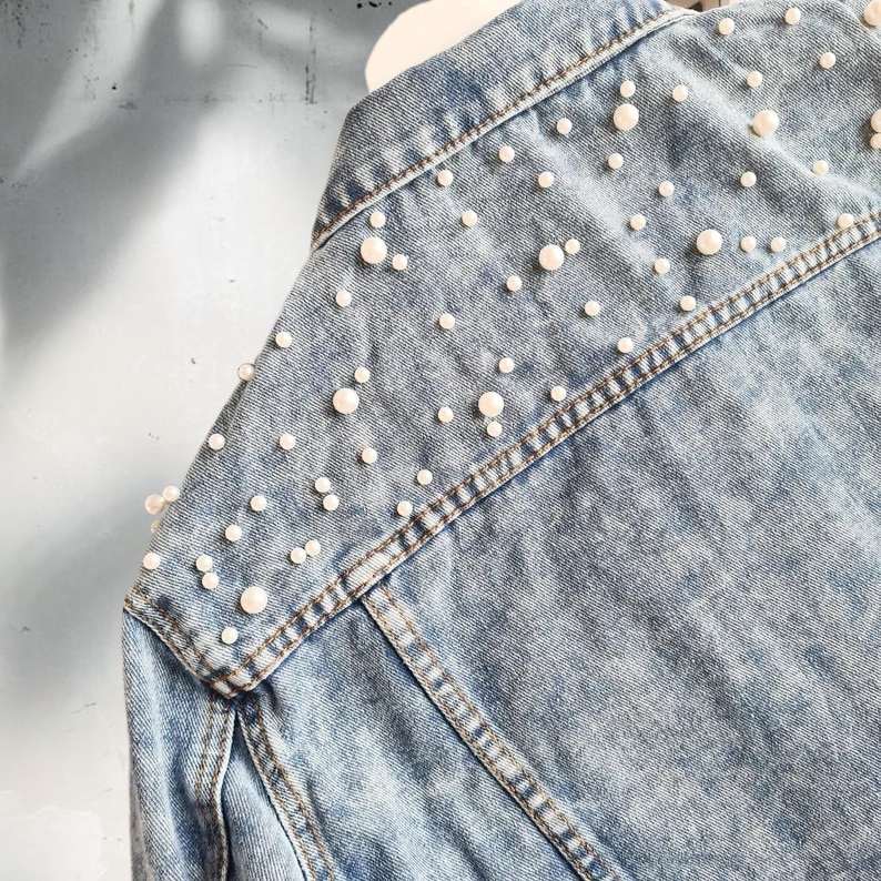 Close-up of pearl embellishments on Mother of the Bride Jacket