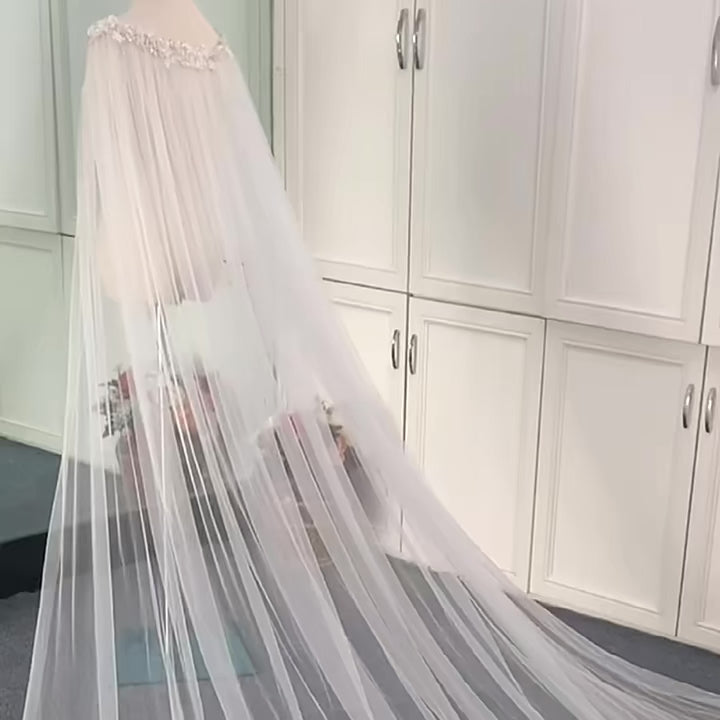 Mannequin showcasing 3-meter long wedding cape with cathedral veil and beading
