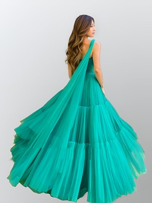 Back view of the Raegan Formal Dress in green, showing the flowing A-line silhouette.