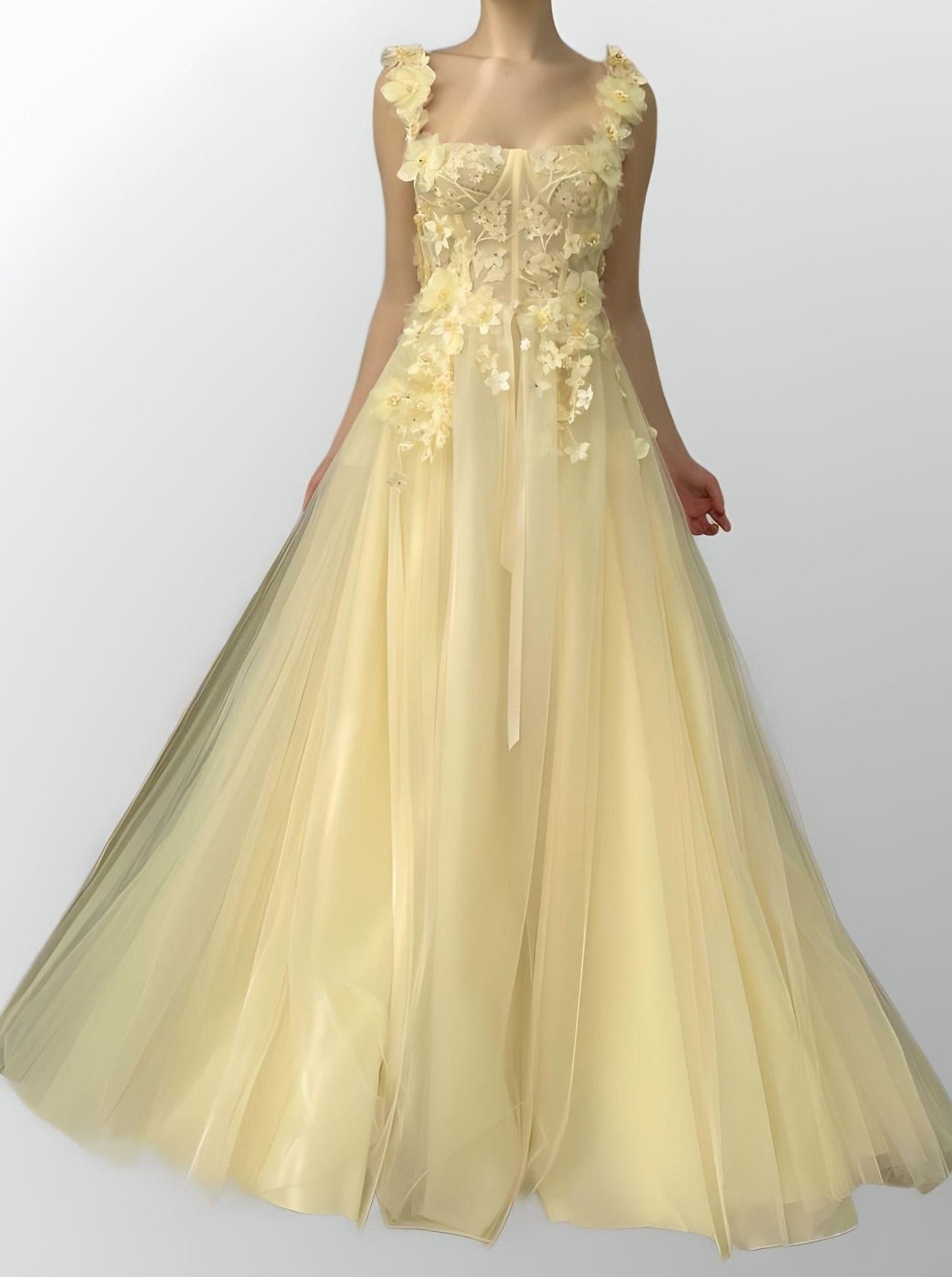 Elegant RAYA light yellow A-line prom dress with spaghetti straps and floral decoration.