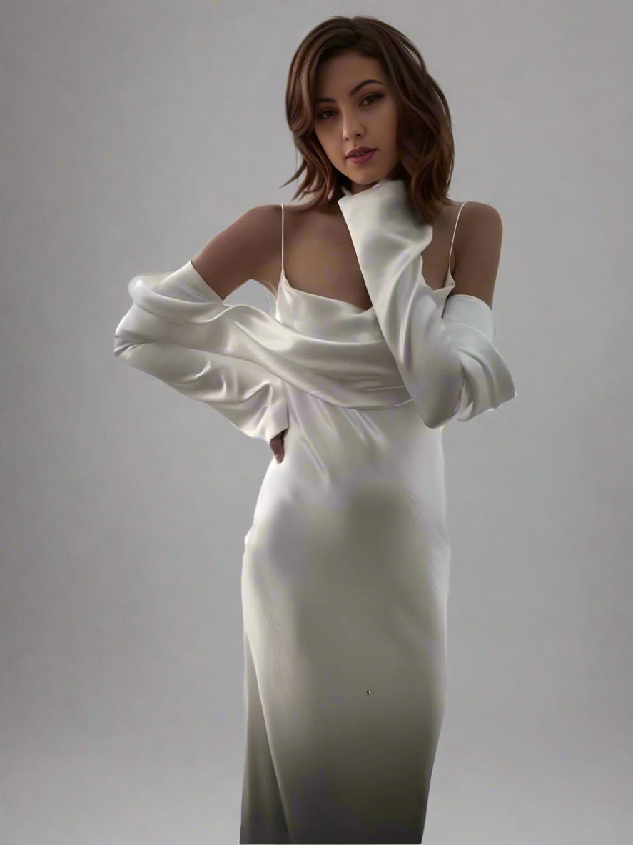 Detail of long sleeves and elegant satin fabric on Resse wedding dress.