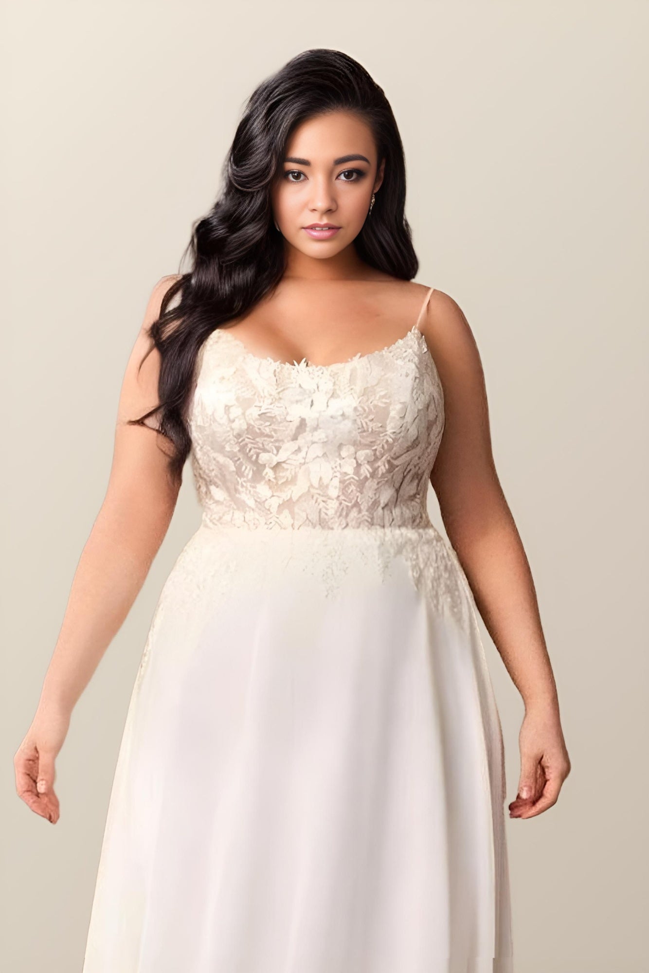 Close-up of intricate leaf lace appliques on the square neckline of the Regina dress