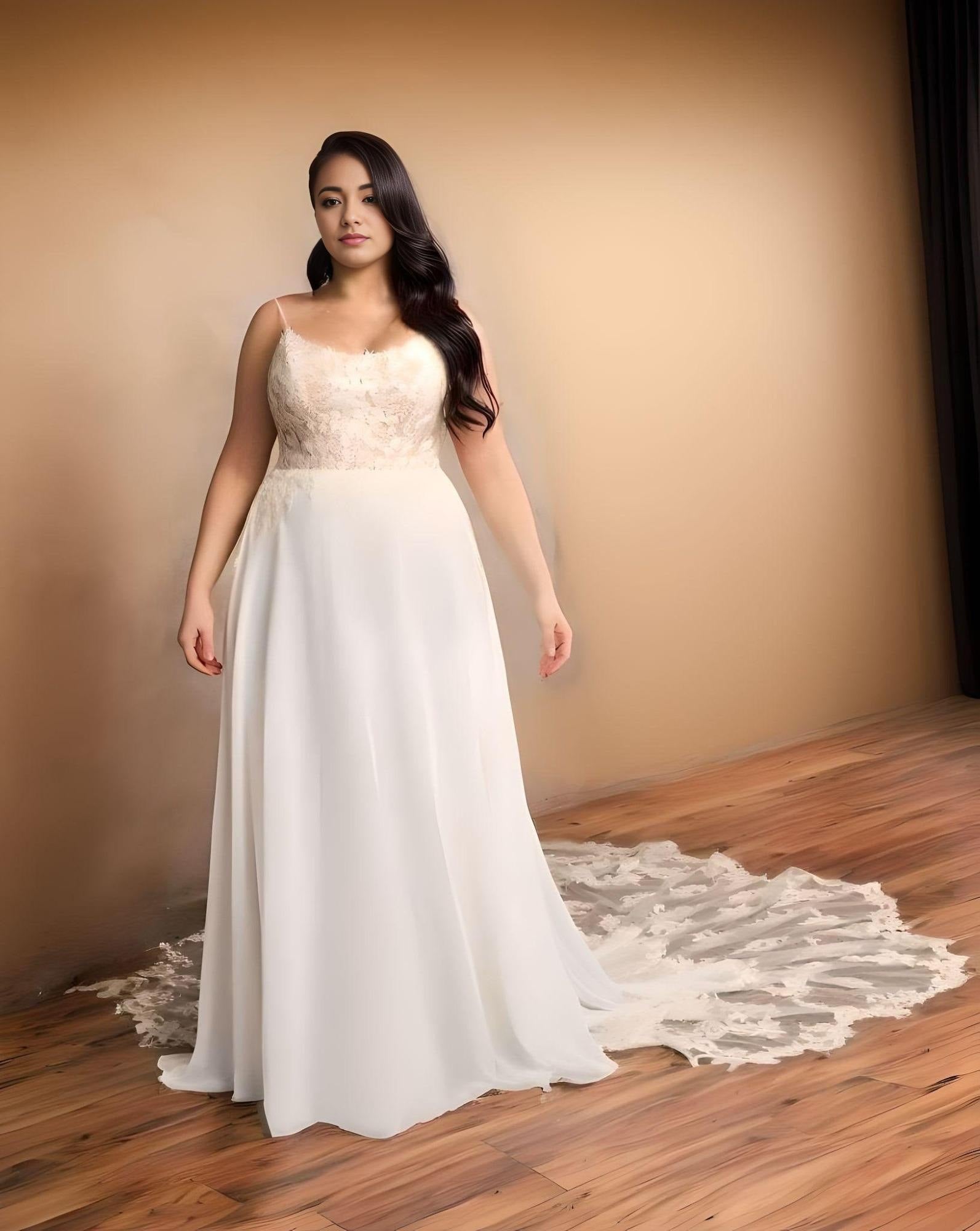 Plus-size bride wearing a boho chiffon wedding dress with spaghetti straps.