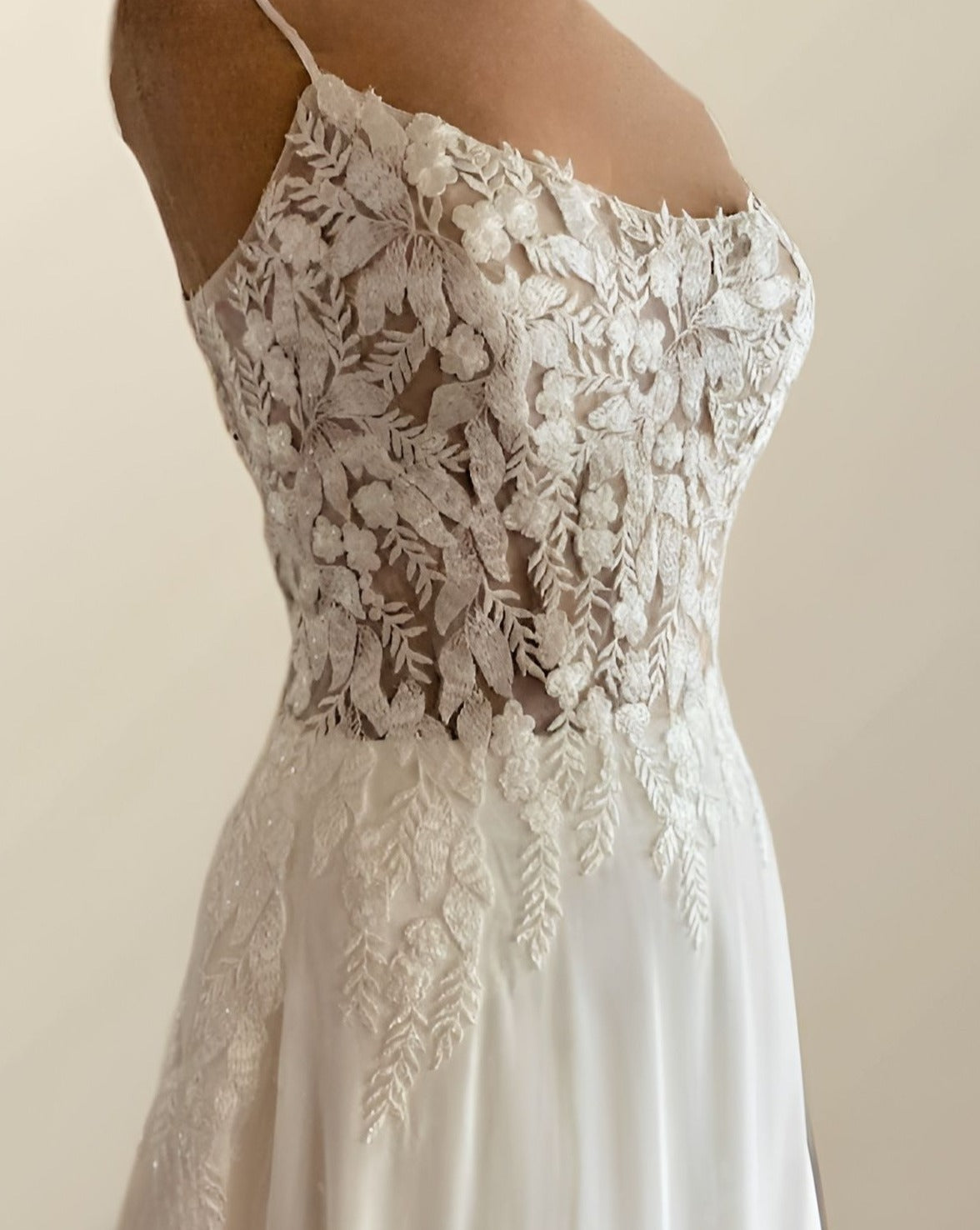 Side profile of a Regina dress with a on a figurine.