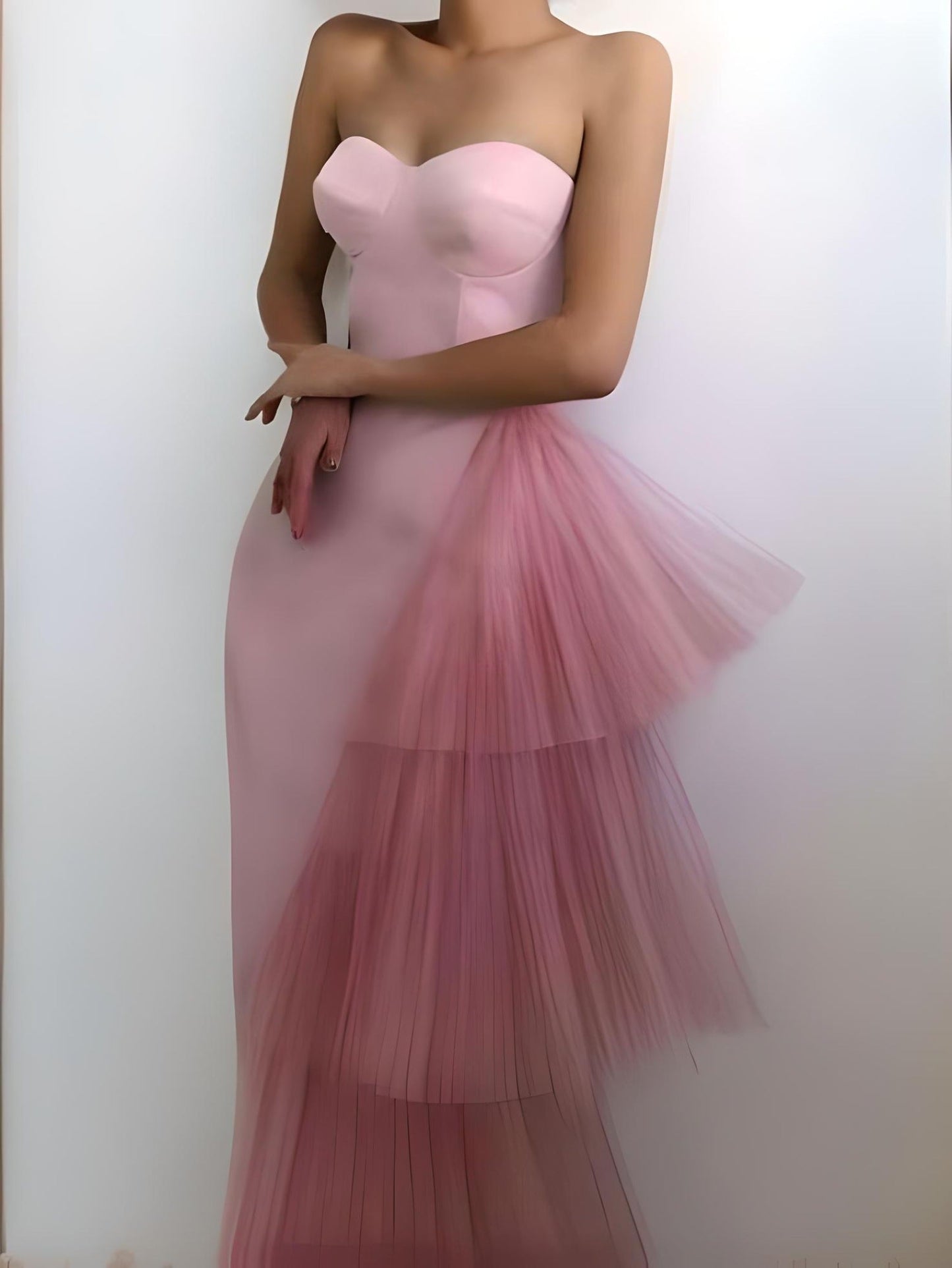 Model in a light pink crepe midi dress with a built-in bra