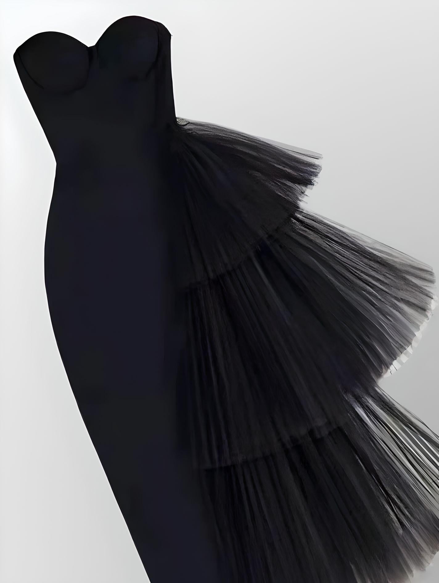 Evening wear featuring a modern black formal dress with layered details