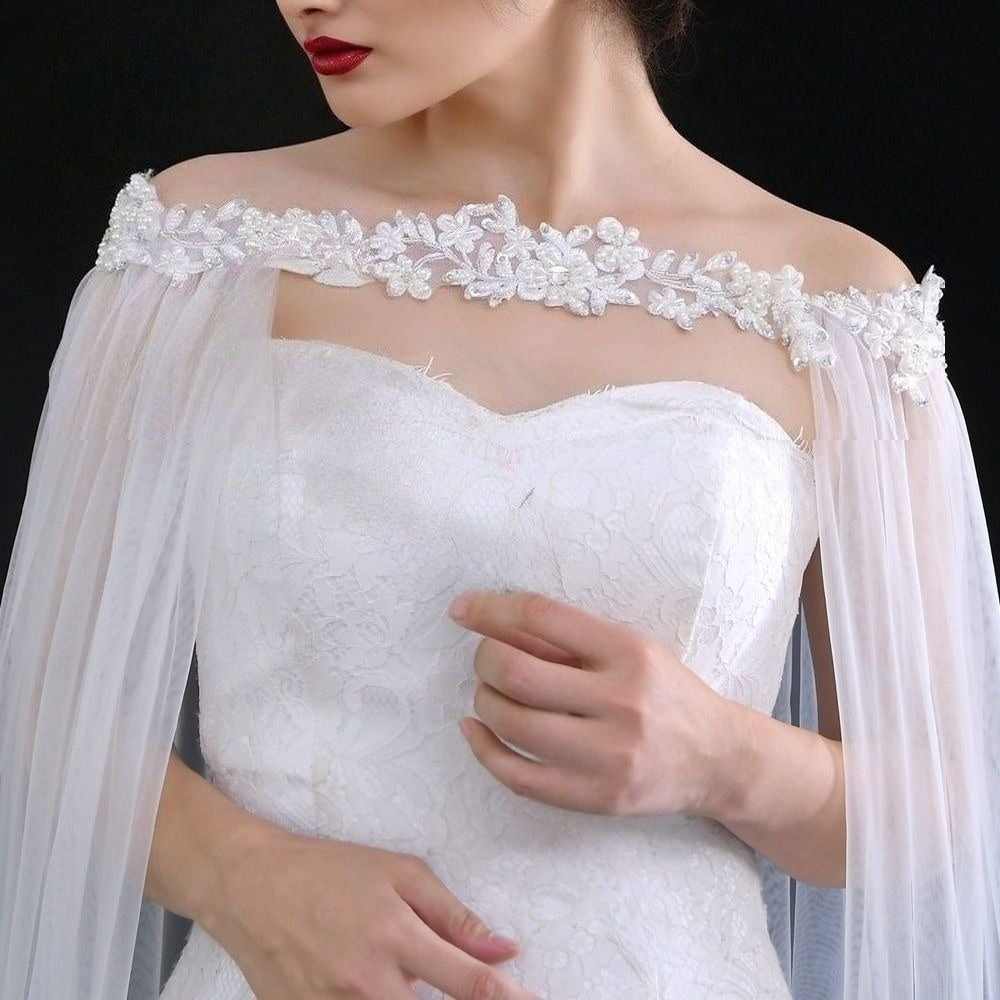 Close-up of beaded rhinestone details on bridal wedding cloak.