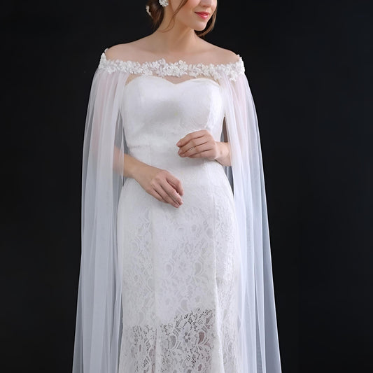 Bride wearing rhinestone beaded wedding cape with 3-meter cathedral veil