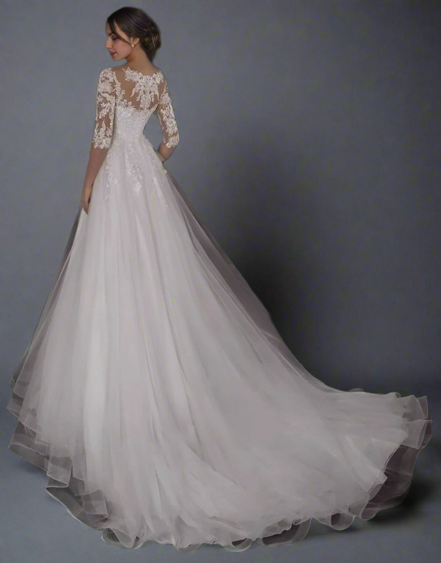 Back view of pregnant bride wearing lace top flowy maternity dress with three quarter lace sleeves
