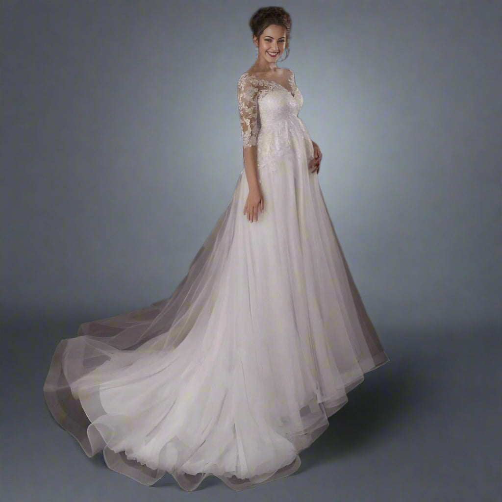 Full-length view of smiling expectant bride holding her belly in Elegant Maternity Wedding Dress