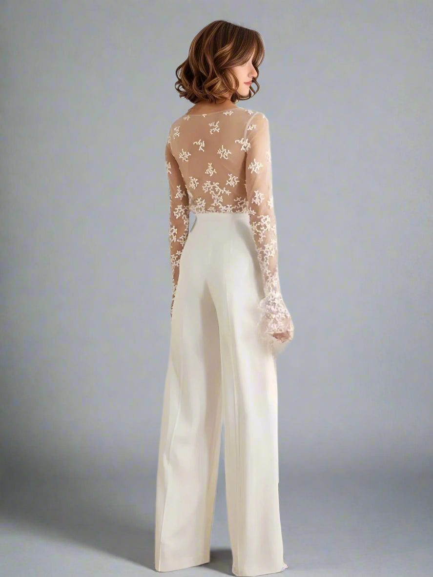 Elegant bride in RYAN jumpsuit showcasing sleek crepe trousers and illusion back.