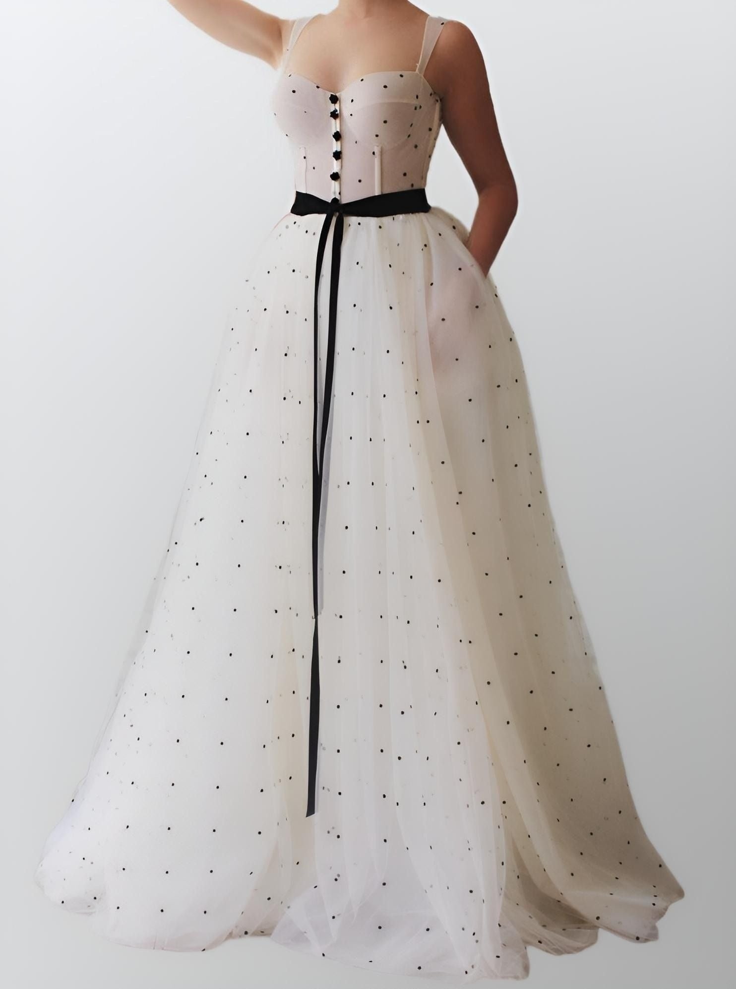 Full-length view of Sanai formal dress with sweep train and pockets.