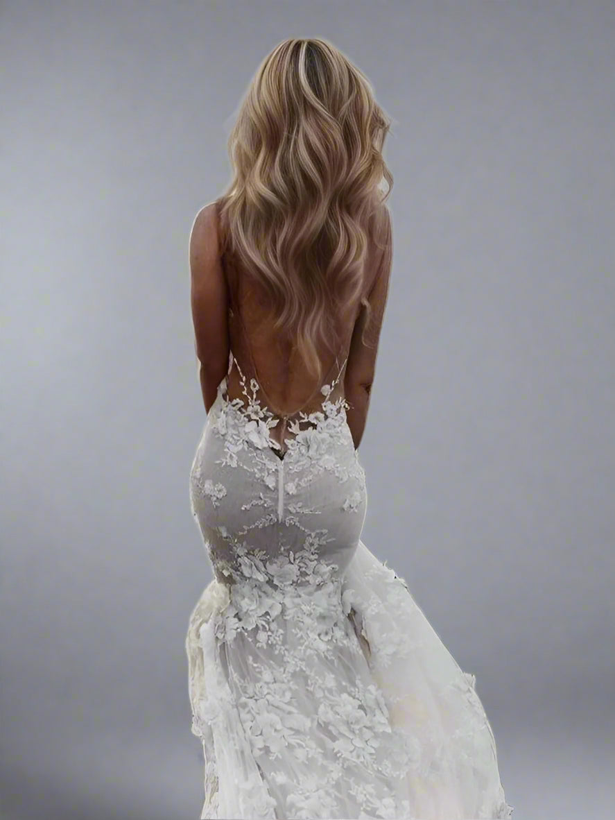 Close-up of 3D lace appliques on backless SANDRA mermaid gown with side cuts.