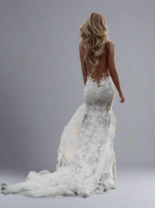 Bride showing back off the stunning mermaid silhouette of the SANDRA wedding dress.