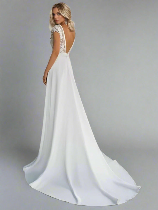 Back view of the Selenia Wedding Dress, highlighting its backless feature and elegant train.