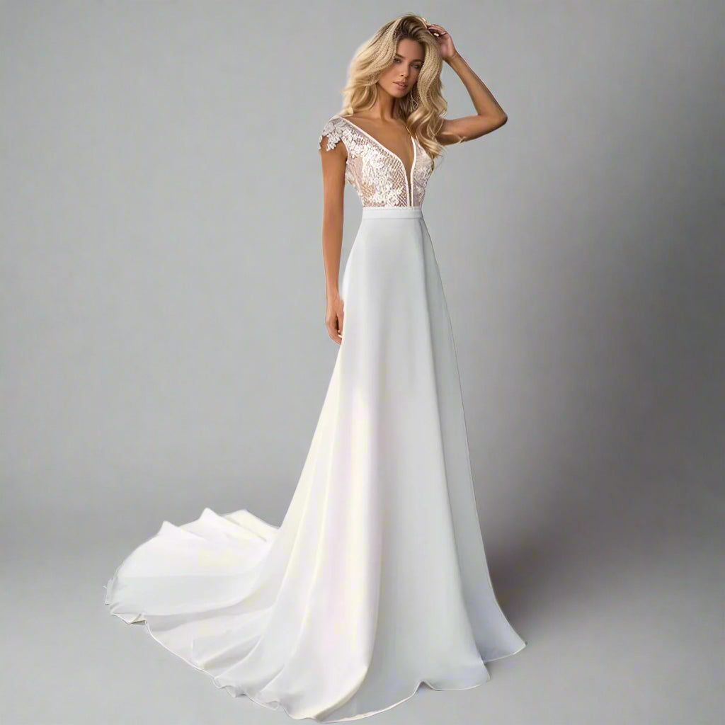 Bride wearing the Selenia Wedding Dress, showcasing its intricate lace top and satin skirt.