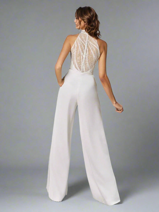 Back view of the Shania Wedding Jumpsuit, emphasizing its sheer shimmering back design.