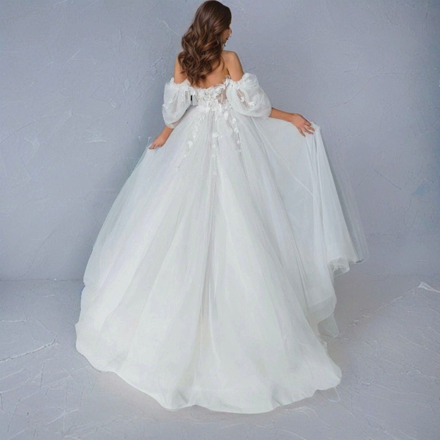 Full-length image of the SHERYL gown with its flowing sweep train.