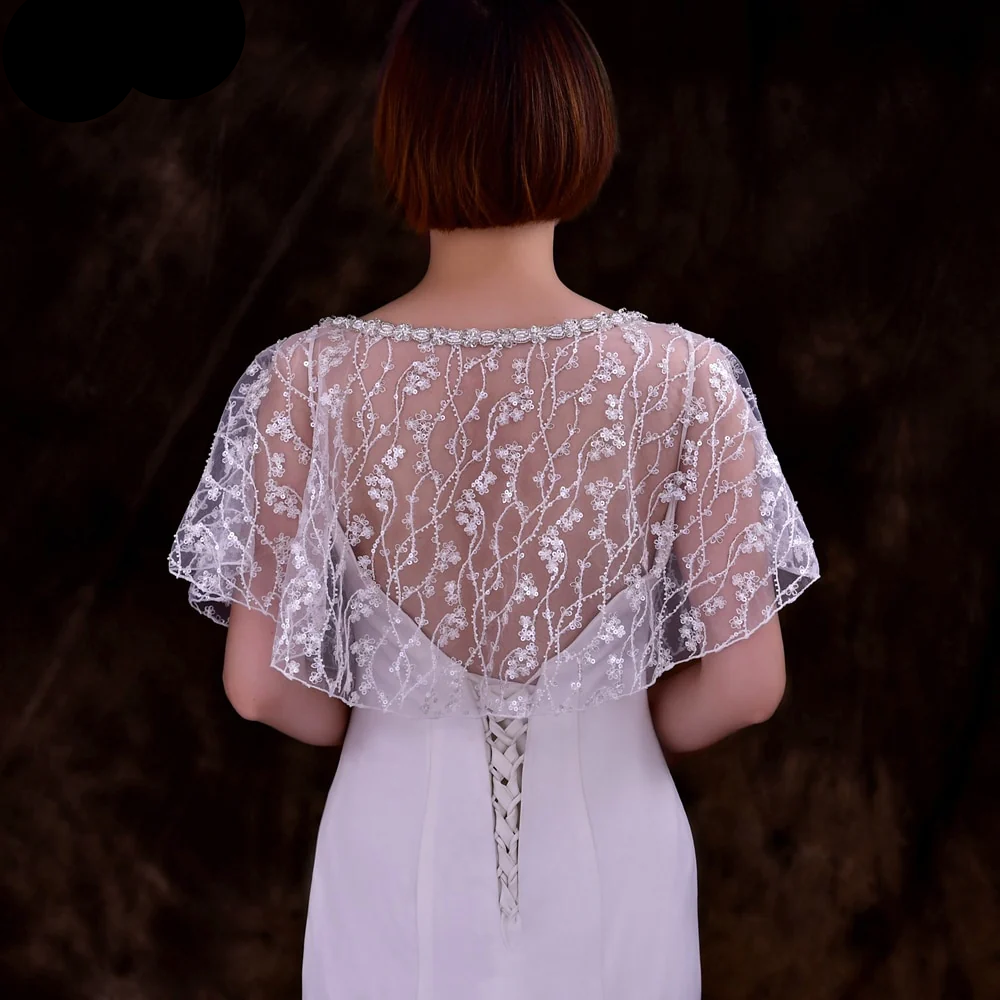 Model gracefully showcasing the Sparkling Beaded Wedding Wrap, adding elegance to her wedding gown.