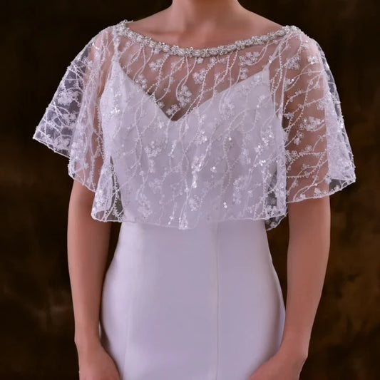 Bridal model wearing the Sparkling Beaded Sequin Bolero over a simple wedding gown.
