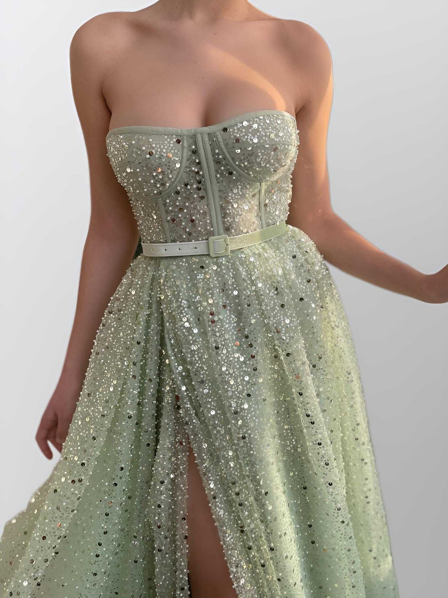 Close-up of the intricate sequins, pearls, and beading on the sweetheart bodice of Stella Formal Dress.