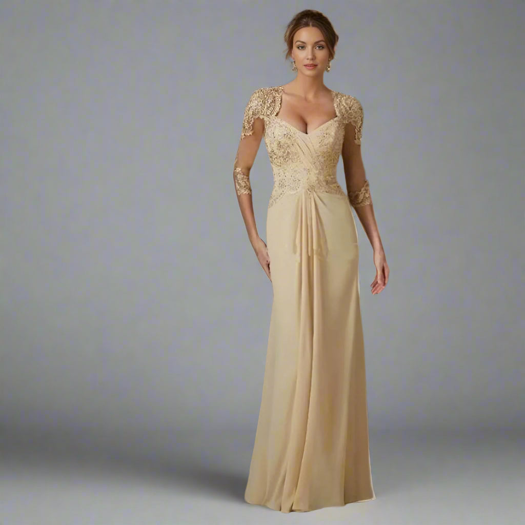 Woman in Mother of the Bride in Champagne Tarina Dress with V-neck and lace mesh sleeves