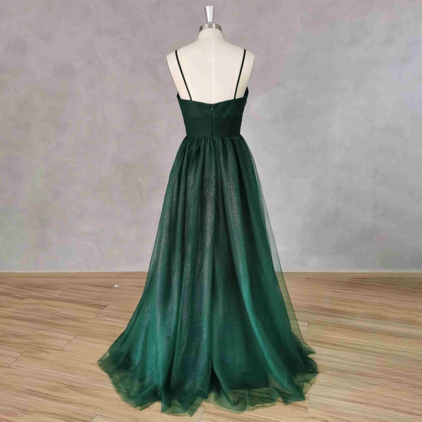 Back view of shimmering emerald green Tessa Formal Couture Dress showing zipper closure