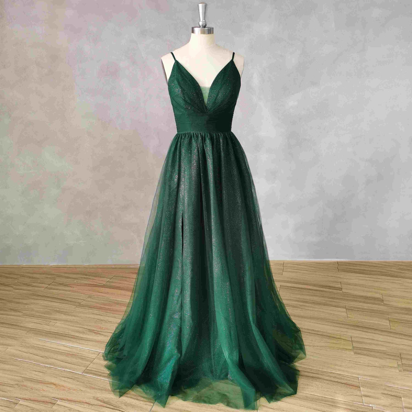 Glamorous emerald green Tessa dress with a sweep train and tulle fabric