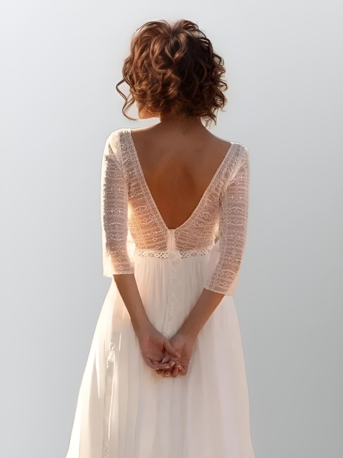 Backless design of Tori Wedding Dress with lace details
