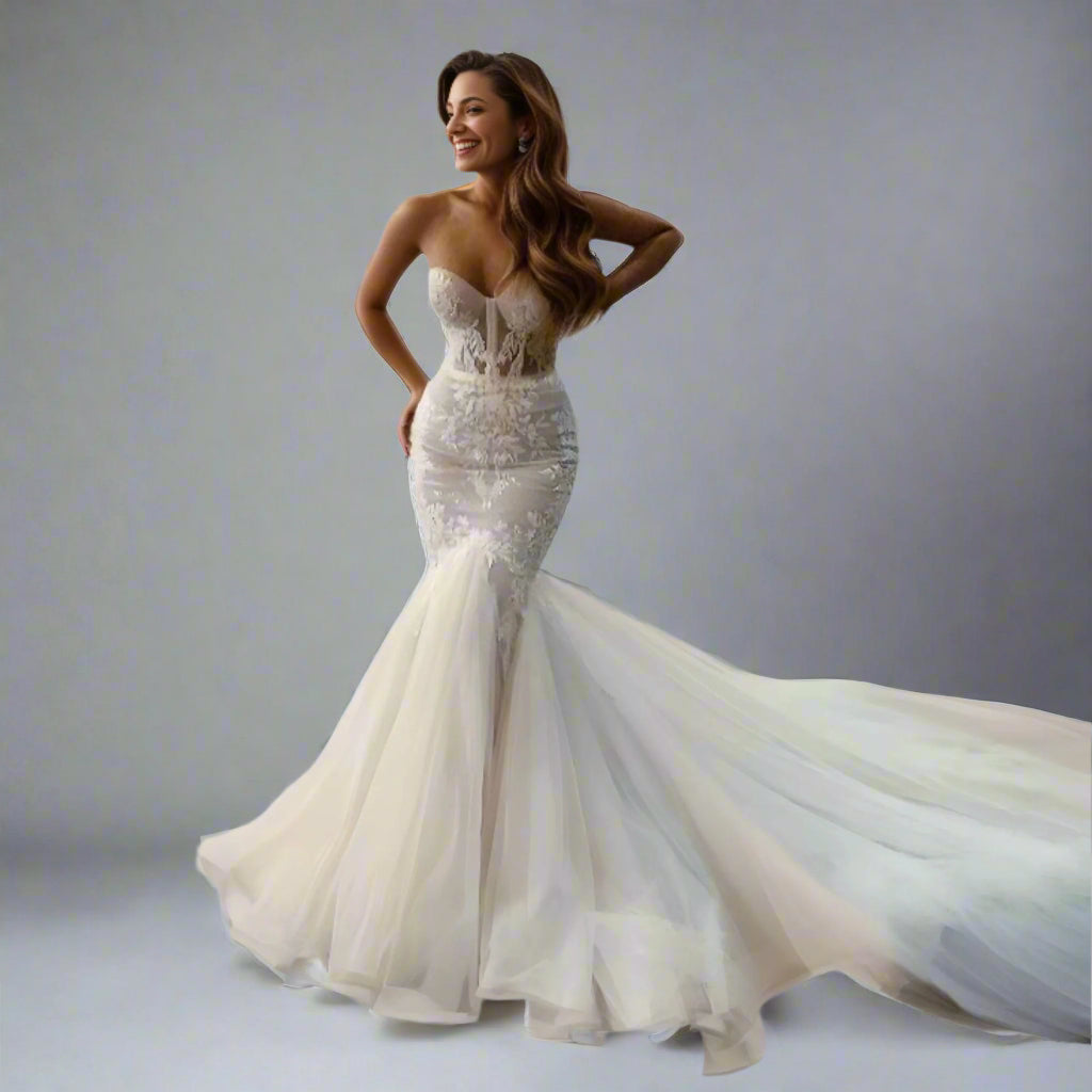 Bride wearing Valentina bridal gown with a sculpted mermaid silhouette and lace appliques
