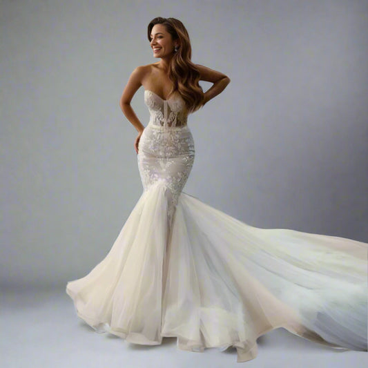 Bride wearing Valentina bridal gown with a sculpted mermaid silhouette and lace appliques