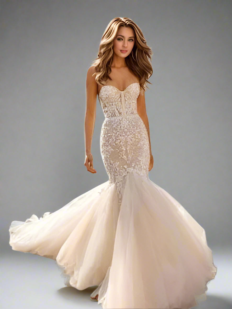 Woman wearing elegant and sultry Valentina wedding dress with a sexy sheer lace bodice