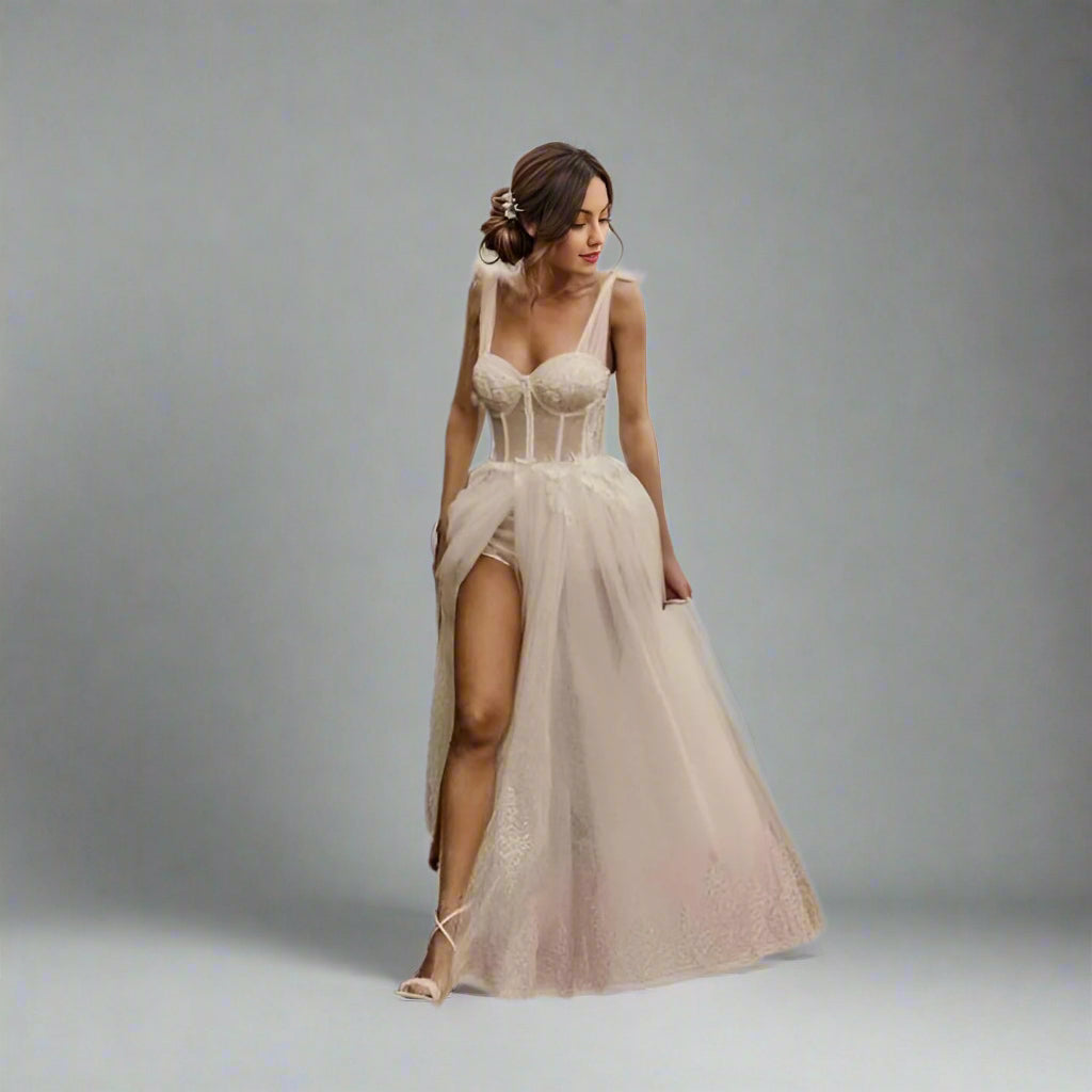 Full-length image of a bride in a glitter lace wedding gown showing leg in high slit.