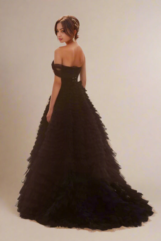Back view of Velma black formal dress with cascading tulle layers.