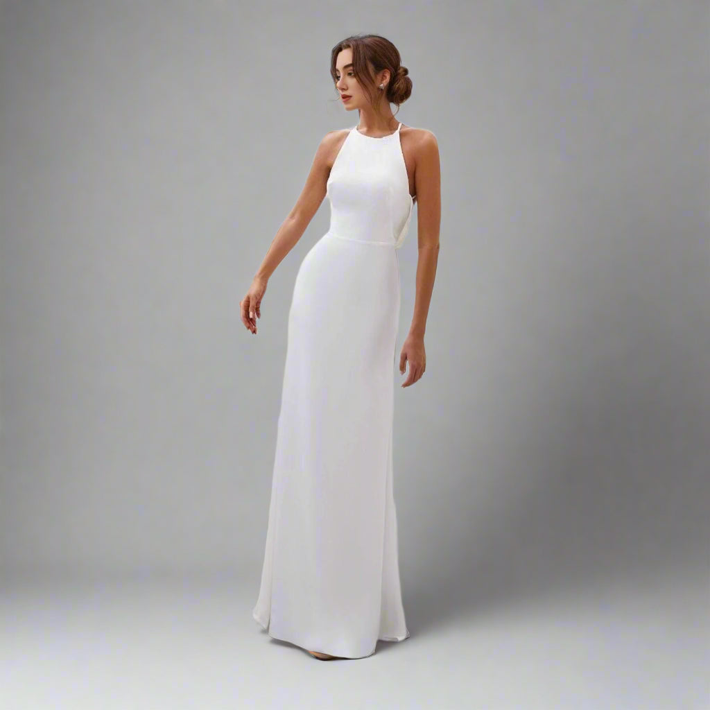 Bride wearing Virginia Wedding Dress with a halter neckline and open back.