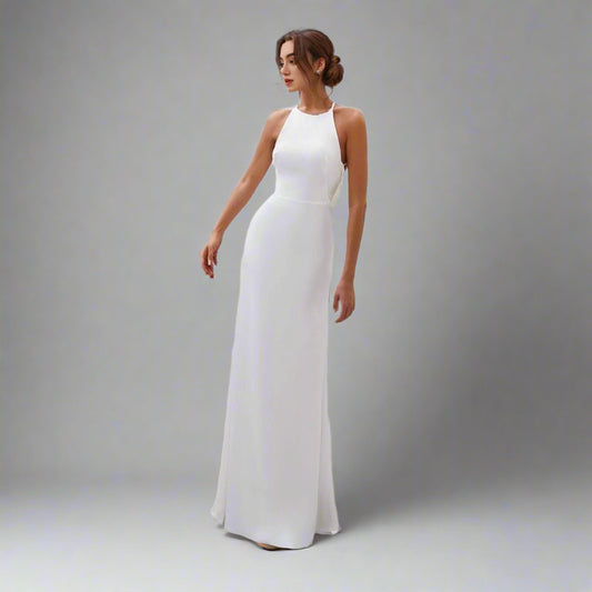 Bride wearing Virginia Wedding Dress with a halter neckline and open back.