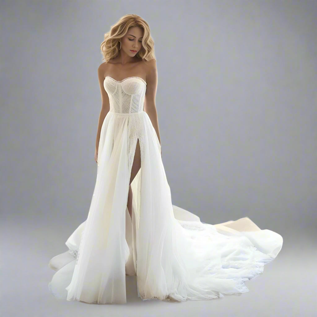 Woman in elegant tulle wedding dress with lace appliques and pleated bodice.