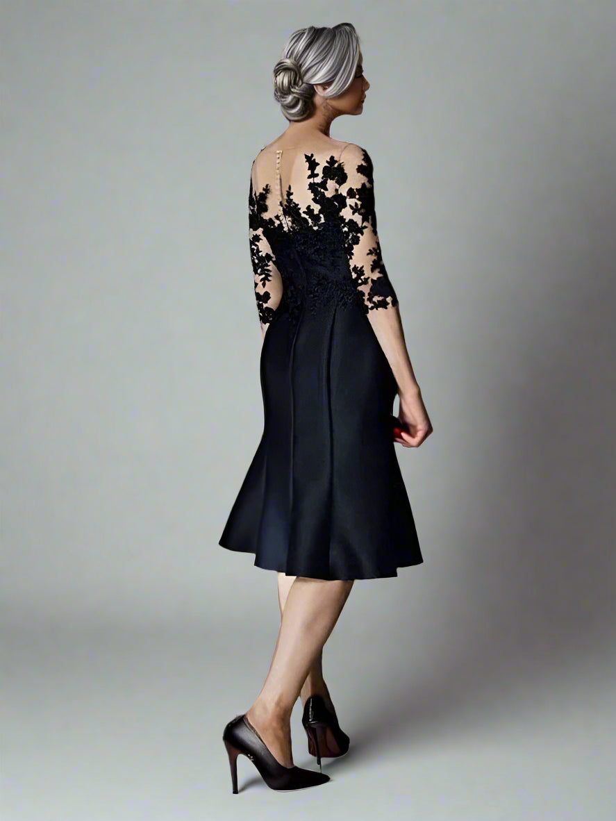 Back view of the Zelda dress showcasing its graceful drape on black satin and lace dress designed for wedding events.