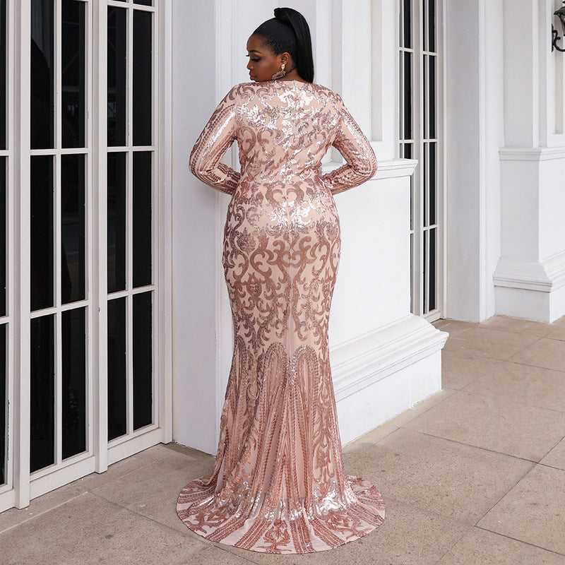 Woman showcasing MARINA mermaid gown with long sleeves and scoop neckline