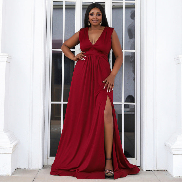 Elegant evening dress featuring a deep V-neckline, pleated detailing, high slit, and a sweep train, designed for a graceful and stylish appearance.