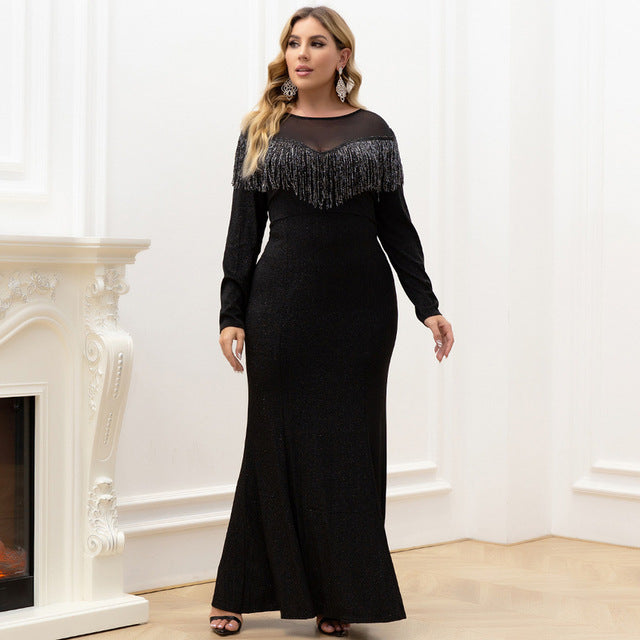 Woman wearing Lyric Formal Dress with scoop neckline and tassel details on the bodice
