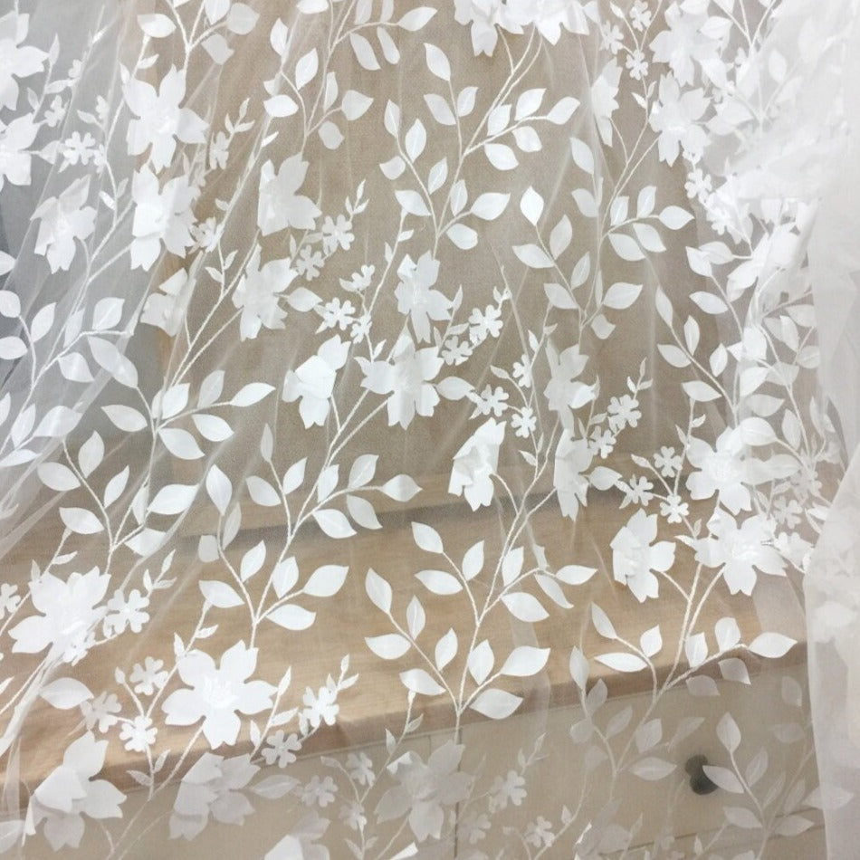 Close-up of intricate lace appliques for the skirt of the SARAI wedding gown.