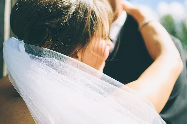 Bride with white wedding veil 