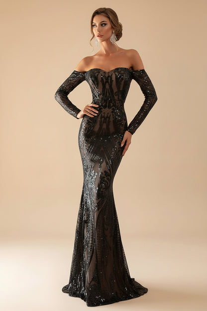 Woman wearing a black sequin off-shoulder gown on a beige background