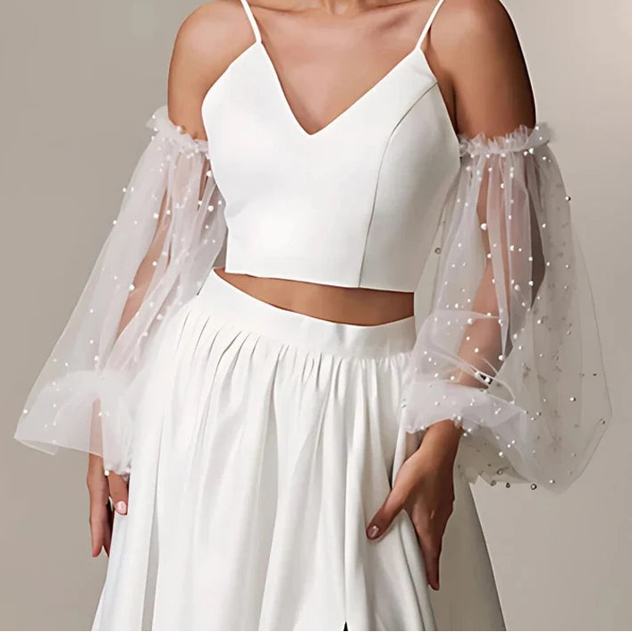 Bride wearing removable pearl puff tulle wedding sleeves with satin bridal dress